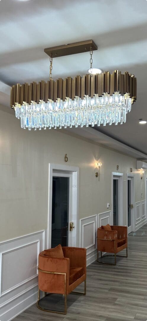 Elegant chandelier above stylish room doors.